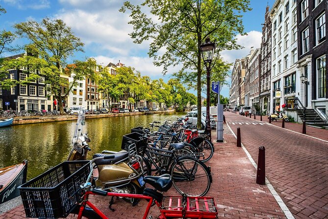 Amsterdam Day Trip from Brussels With Cheese, Clogs and Windmills - Dam Square, the Royal Palace, and the Red Light District