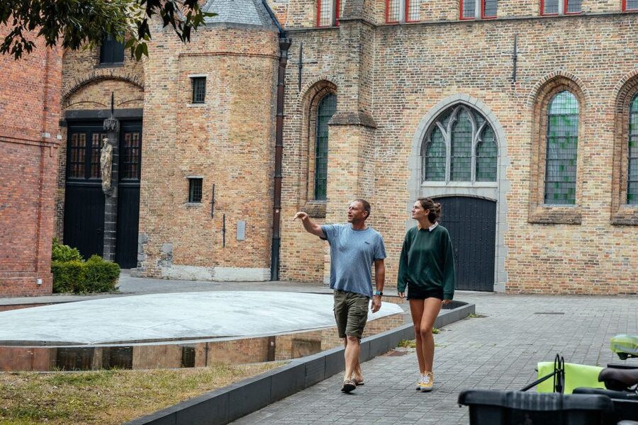 Bruges: Private Tour with Locals – Highlights & Hidden Gems - Burg Square and the city’s public face