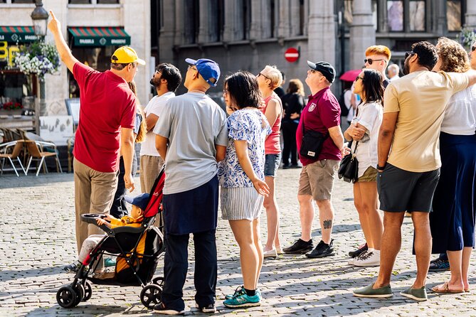 Brussels: Historical Walking Tour with Chocolate & Waffle Tasting - Grand Place and the symbols in the stone