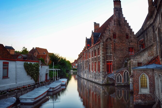Experience the best of Bruges on a Private Tour with Boat Ride - The canal boat near the Church of Our Lady