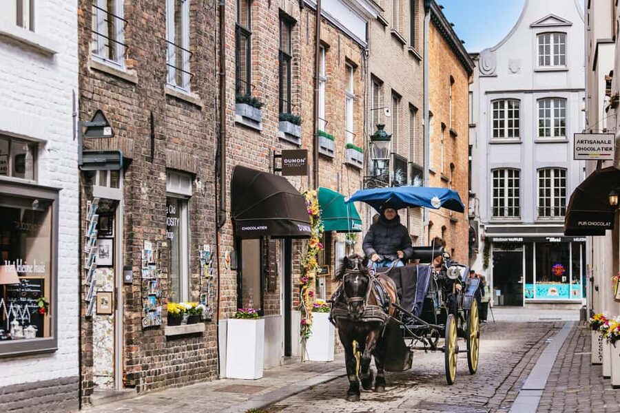 From Brussels: Bruges & Ghent Day Tour - 2 Fairytale Cities - Guides, headsets, and the pace of the day